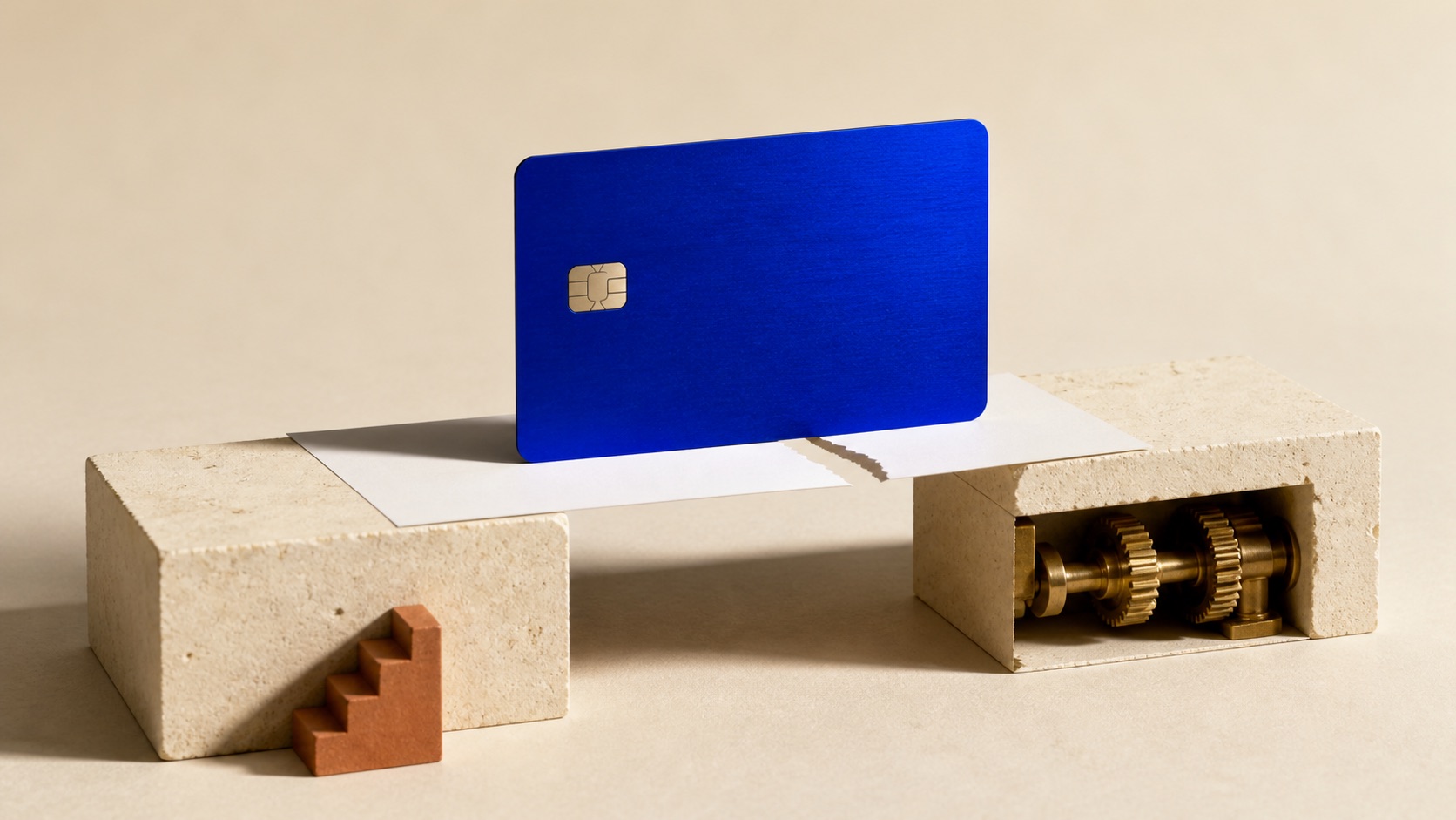 AI concept: a blue payment card stands over a torn paper bridge, contrasting a conditional bid with an operating business